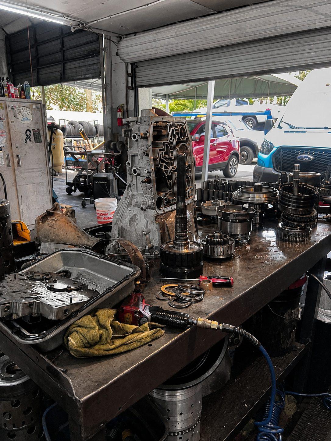 Valve body and clutch drums laid out on the workbench